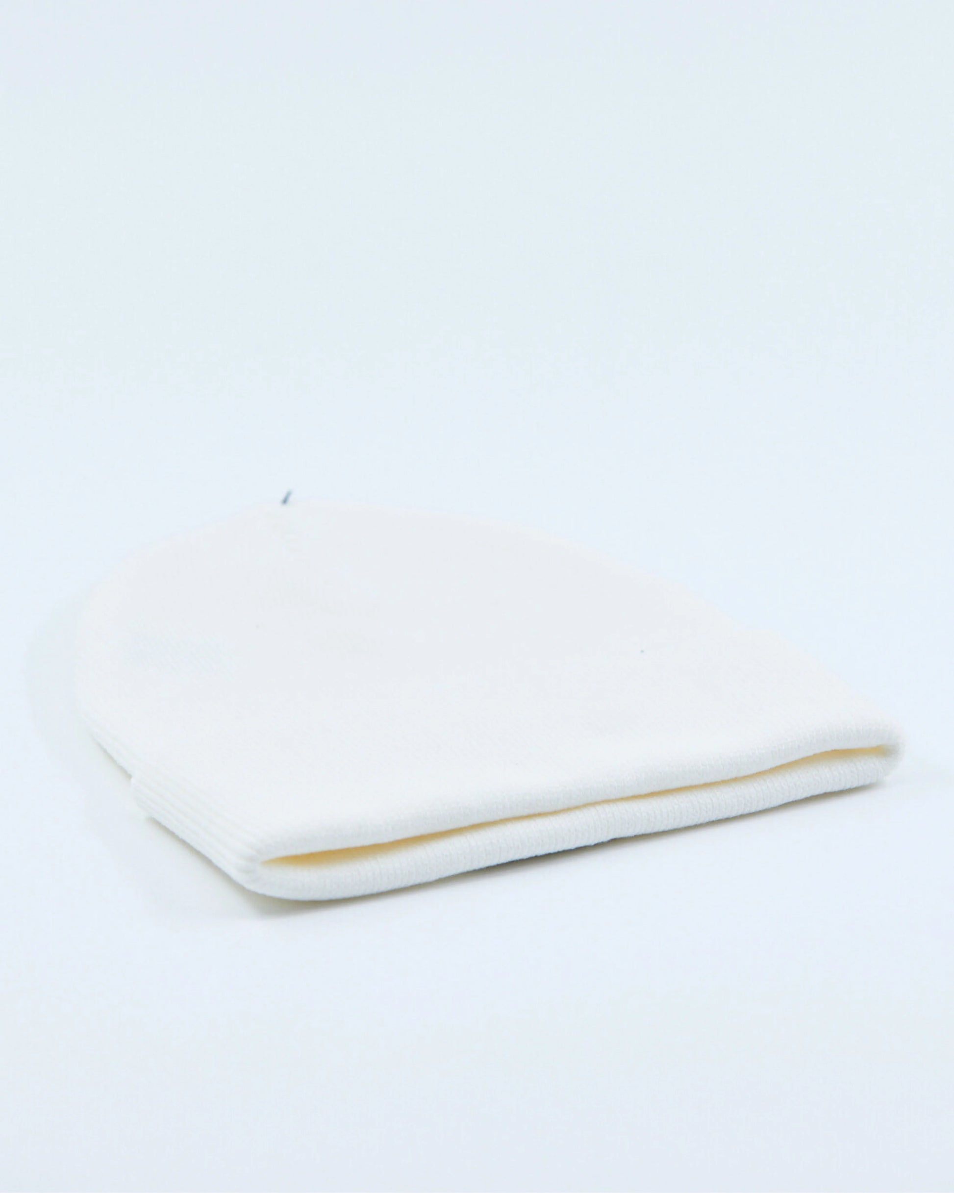 White beanie on a light gray background