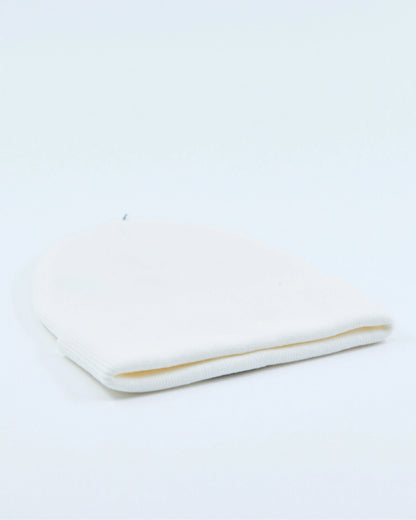 White beanie on a light gray background