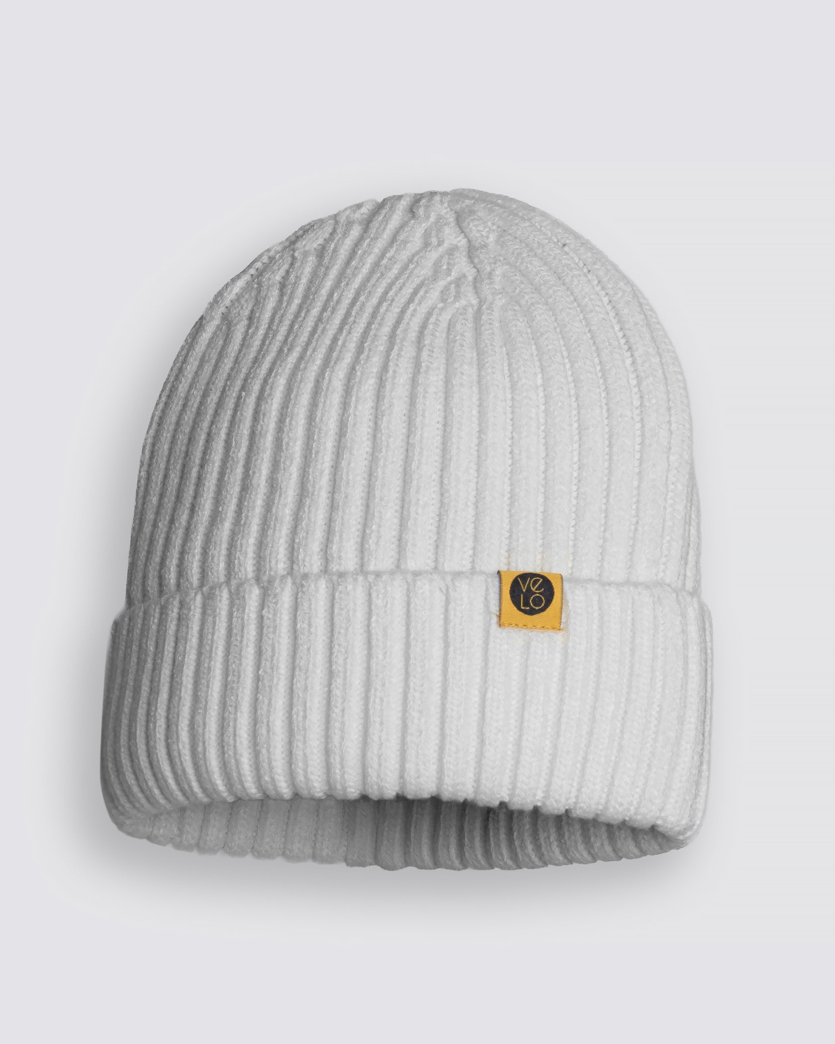White Classic Beanie with a brand logo on a light gray background