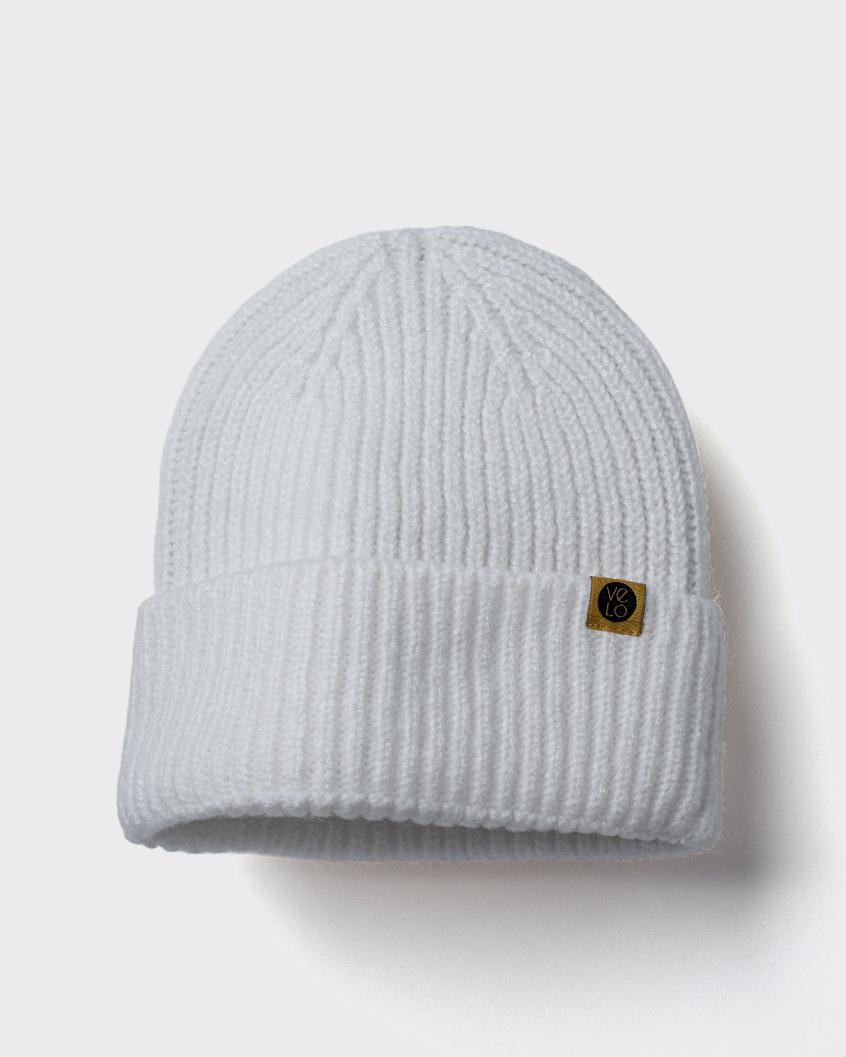 White Lux Beanie on a light gray background
