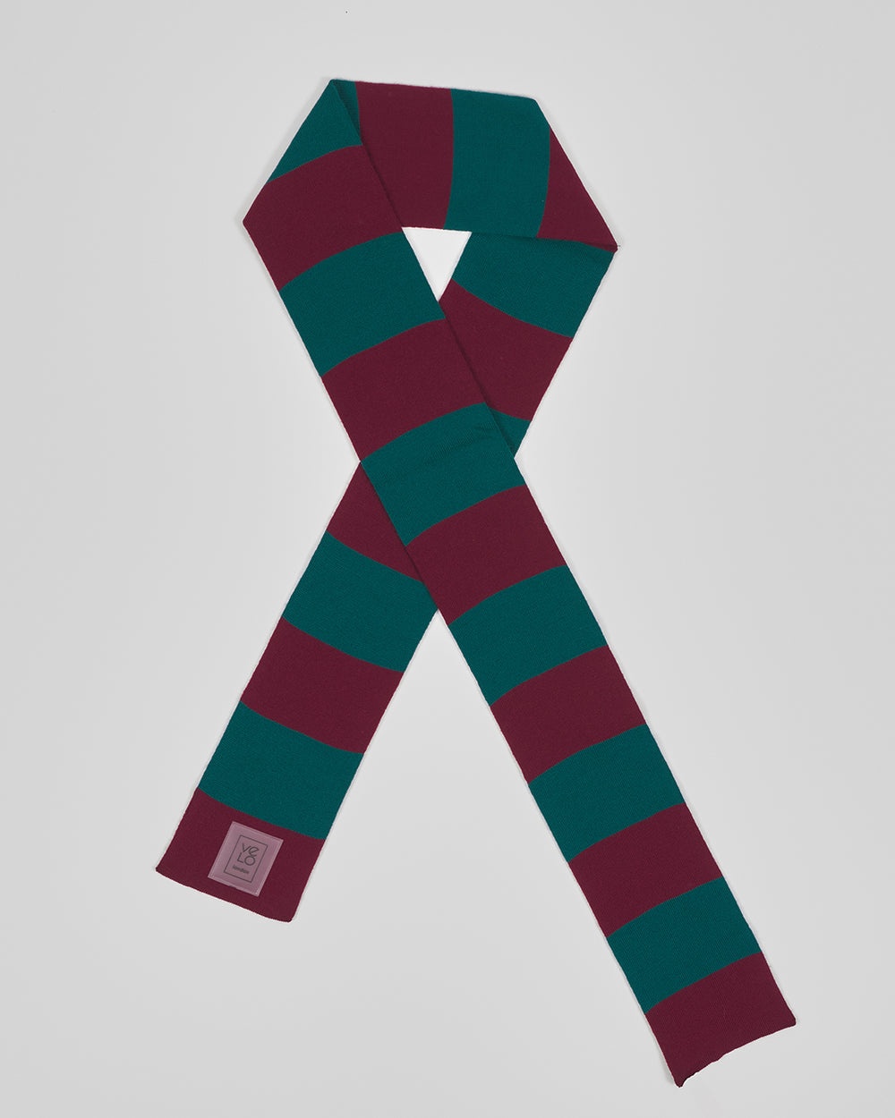 Wine & Pine unisex acrylic scarf flat lay in rich wine burgundy and deep pine green