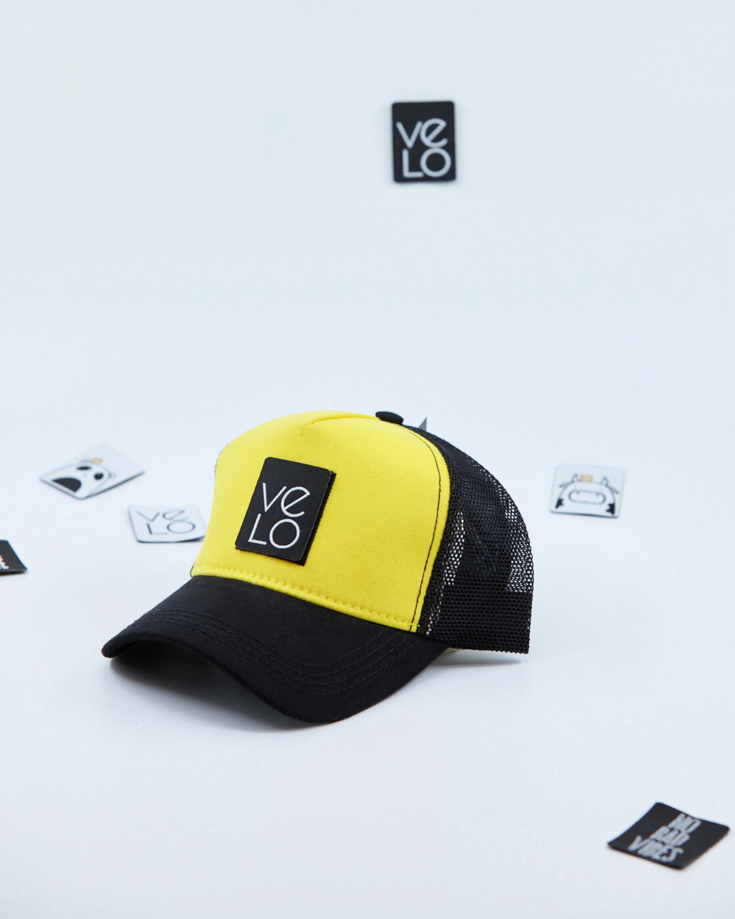 Side view of Yellow and Black Customisable Trucker Cap with patches