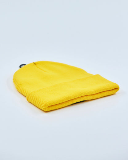Yellow beanie on a light gray background