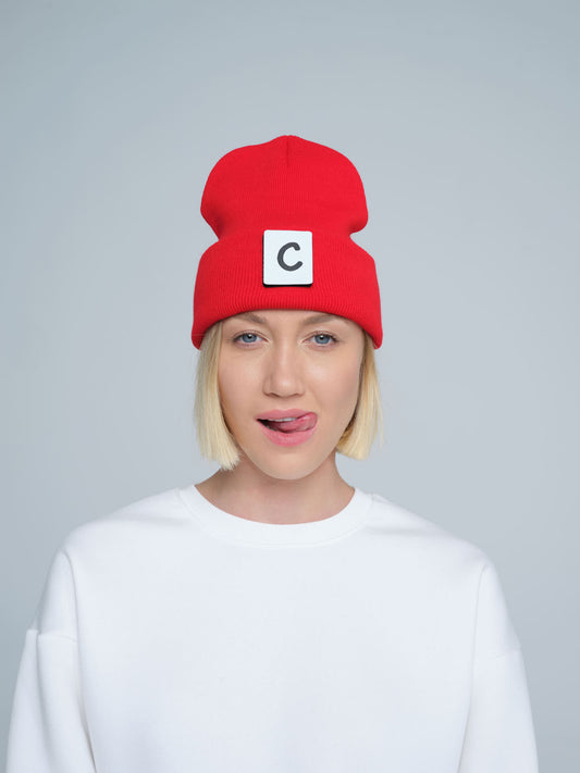 women wearing hot red beanie with 'C' letter patch on it