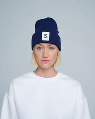 women wearing royal navy beanie with 'S'  letter patch on it